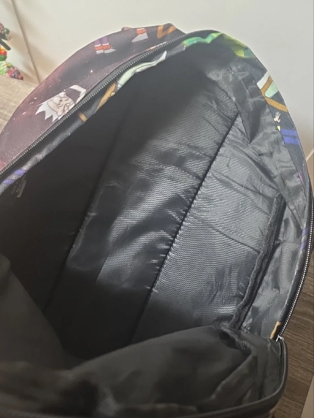 Bioworld Rick and Morty Graphic Backpack - Black with Purple Accents